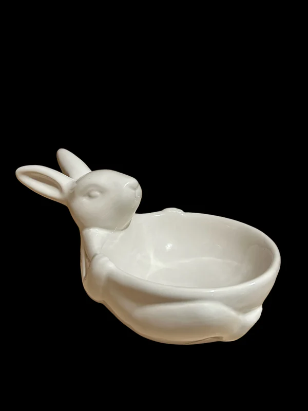 A white ceramic bunny holds a small bowl and is named "Bunny Bowl".