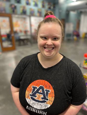 Smiling person with Auburn t-shirt